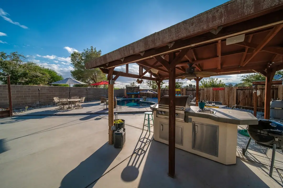 Beautifully finished concrete pool deck and outdoor kitchen area, showcasing durable residential concrete applications