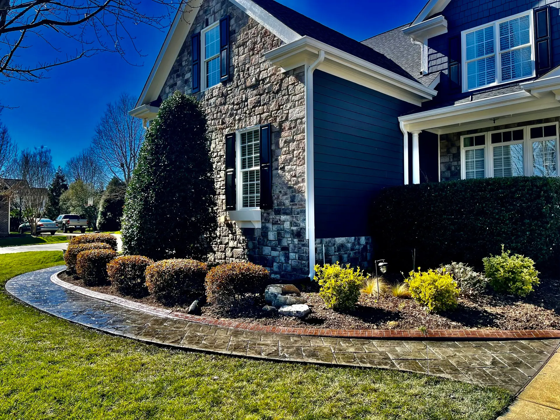 Decorative concrete walkway installation at a residential home in Raleigh, NC