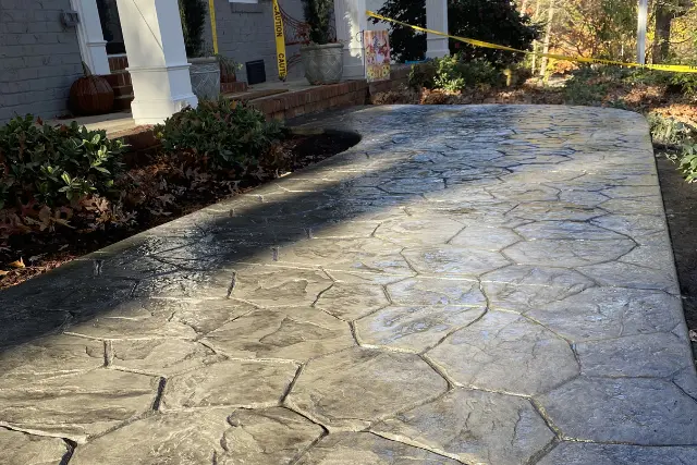A decorative, stamped concrete walkway completed by RGPACK CONCRETE at a home in the Cedar Hills Estates neighborhood of Raleigh, NC.
